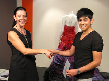 Carlos Bouman receives the People's Choice Award from Dyson's Erica Galea