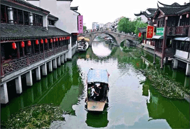 Scene depicting Chinese canal and bridge